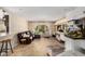 Open living room with tile floors, leather couch, aquarium, and bar area at 2256 S Las Flores --, Mesa, AZ 85202