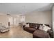 Open concept living room features tile floors, leather couch, and adjacent bar at 2256 S Las Flores --, Mesa, AZ 85202