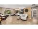 Bright living room showcases an aquarium, neutral furniture, and large window at 2256 S Las Flores --, Mesa, AZ 85202