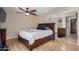 Well-lit main bedroom featuring hardwood floors and an ensuite bathroom with modern features at 2256 S Las Flores --, Mesa, AZ 85202