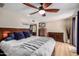 Spacious main bedroom showcases wood flooring, ceiling fan, and walk-in closet at 2256 S Las Flores --, Mesa, AZ 85202