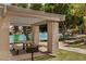 Park pavilion with picnic tables overlooking a lake and lush green space at 2256 S Las Flores --, Mesa, AZ 85202