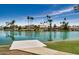 Waterfront community featuring a private dock, lush landscaping, and serene lake views at 2256 S Las Flores --, Mesa, AZ 85202