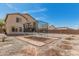Large backyard with a trampoline, desert landscaping, and a fence for added privacy at 25420 W Park Ave, Buckeye, AZ 85326
