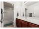 Well-lit bathroom with a vanity sink, a shower-tub combination and tiled floors at 25420 W Park Ave, Buckeye, AZ 85326
