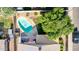 Aerial view of a backyard featuring a sparkling pool, well-manicured landscaping, and a cozy patio area perfect for entertaining at 2615 N 123Rd Dr, Avondale, AZ 85392