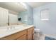 Bathroom with double sinks, vanity and framed mirror, exuding a blend of functionality and comfort at 2615 N 123Rd Dr, Avondale, AZ 85392