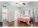 Vaulted ceilings, beautiful floors and a light, airy feel define this bedroom with walk-in closet at 2615 N 123Rd Dr, Avondale, AZ 85392