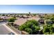 Charming single-story home featuring lush landscaping, tiled roof, and a private backyard pool in a tranquil neighborhood at 2615 N 123Rd Dr, Avondale, AZ 85392