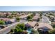 Bird's eye view of a charming home featuring a backyard pool, mature trees, and desert landscaping in a quiet neighborhood at 2615 N 123Rd Dr, Avondale, AZ 85392