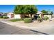 Charming front yard featuring well-manicured landscaping and a traditional home design at 2615 N 123Rd Dr, Avondale, AZ 85392