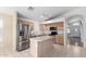 Modern kitchen features stainless steel appliances, a center island, and ample cabinet space for easy meal preparation at 2615 N 123Rd Dr, Avondale, AZ 85392