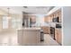 Well-equipped kitchen with stainless steel appliances, center island, and ample cabinet space for storage at 2615 N 123Rd Dr, Avondale, AZ 85392