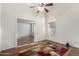 Inviting living room with vaulted ceilings, wood floors, ample natural light, and decorative rug at 2615 N 123Rd Dr, Avondale, AZ 85392