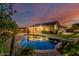 Backyard pool and patio reflecting home at dusk at 2741 E Odessa St, Mesa, AZ 85213