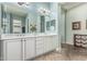 Bathroom with double sinks, tile flooring, and a large vanity mirror at 2741 E Odessa St, Mesa, AZ 85213