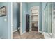 Bright bathroom with blue walls, neutral tile floor, and a glass shower enclosure at 2741 E Odessa St, Mesa, AZ 85213