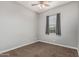 Spare bedroom featuring neutral walls, brown carpet, and a window with blinds at 2741 E Odessa St, Mesa, AZ 85213