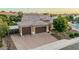Aerial view of home with tile roof, three-car garage, and a paved driveway at 2741 E Odessa St, Mesa, AZ 85213