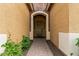 Inviting front door with stone accents, a brick paver walkway, and mature landscaping at 2741 E Odessa St, Mesa, AZ 85213