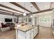 Modern kitchen with an island, granite countertops, pendant lights, and stainless steel appliances at 2741 E Odessa St, Mesa, AZ 85213