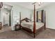Inviting main bedroom with neutral walls, plush carpet, and four-poster bed at 2741 E Odessa St, Mesa, AZ 85213