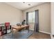 Home office featuring wood-look tile floors, a desk, and neutral paint at 2741 E Odessa St, Mesa, AZ 85213