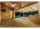 Covered patio featuring an outdoor kitchen, built-in grill, and a view of the pool at 2741 E Odessa St, Mesa, AZ 85213