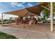 Neighborhood playground featuring slides, climbing structures, and a sunshade in a sand-filled area at 2741 E Odessa St, Mesa, AZ 85213