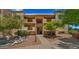 Apartment complex exterior with balconies, mature landscaping, and walkway to stairwell at 3031 N Civic Center Plz # 355, Scottsdale, AZ 85251