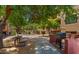 Exterior apartment complex view with walkway, grill, and community picnic table at 3031 N Civic Center Plz # 355, Scottsdale, AZ 85251