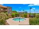 Community hot tub area with lush landscaping, mature trees, and outdoor grill at 3031 N Civic Center Plz # 355, Scottsdale, AZ 85251