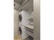 A conveniently stacked washer and dryer with shelving to maximize space at 3031 N Civic Center Plz # 355, Scottsdale, AZ 85251