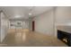 Spacious living room featuring a fireplace and an open concept kitchen in the background at 3031 N Civic Center Plz # 355, Scottsdale, AZ 85251