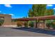 Designated covered parking area with mature landscaping creating privacy and curb appeal at 3031 N Civic Center Plz # 355, Scottsdale, AZ 85251