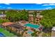 A gorgeous aerial view of the pool and spa with lounge seating and lush greenery at this lovely community at 3031 N Civic Center Plz # 355, Scottsdale, AZ 85251