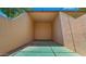 Indoor racquetball court with green floor and white walls with chainlink fence at 3031 N Civic Center Plz # 355, Scottsdale, AZ 85251