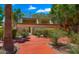 Outdoor racquetball court surrounded by mature landscaping and brick pathway at 3031 N Civic Center Plz # 355, Scottsdale, AZ 85251