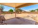 A shaded patio overlooking a spacious dirt backyard at 30601 N Royal Oak Way, San Tan Valley, AZ 85143