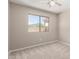 A carpeted room with a view of the home's backyard at 30601 N Royal Oak Way, San Tan Valley, AZ 85143