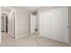 Neutral bedroom featuring sliding door closet and entry to en-suite bathroom at 30601 N Royal Oak Way, San Tan Valley, AZ 85143