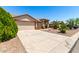 Single-Gathering home with a two-car garage, desert landscaping, and a neutral color palette at 30601 N Royal Oak Way, San Tan Valley, AZ 85143