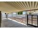 Covered backyard featuring decorative rock and a block fence for added privacy at 3307 E Kings Ave, Phoenix, AZ 85032