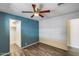Cozy bedroom featuring vinyl flooring, ceiling fan, and closet at 3307 E Kings Ave, Phoenix, AZ 85032