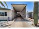 Extended carport showcasing ample covered parking space leading to the mobile home at 3307 E Kings Ave, Phoenix, AZ 85032