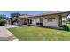 Exterior of the Palm Lakes Village office and clubhouse, featuring well-maintained landscaping and inviting entrance at 3307 E Kings Ave, Phoenix, AZ 85032
