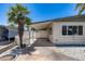 Street view of mobile home, with a carport on a sunny day at 3307 E Kings Ave, Phoenix, AZ 85032