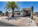 Charming mobile home featuring a well-manicured yard, carport, and desert landscaping at 3307 E Kings Ave, Phoenix, AZ 85032