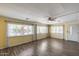 Living room with wood floors, with views of the outside and white trim at 3307 E Kings Ave, Phoenix, AZ 85032