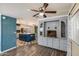 Open layout of the living room with a ceiling fan and built-in cabinets at 3307 E Kings Ave, Phoenix, AZ 85032